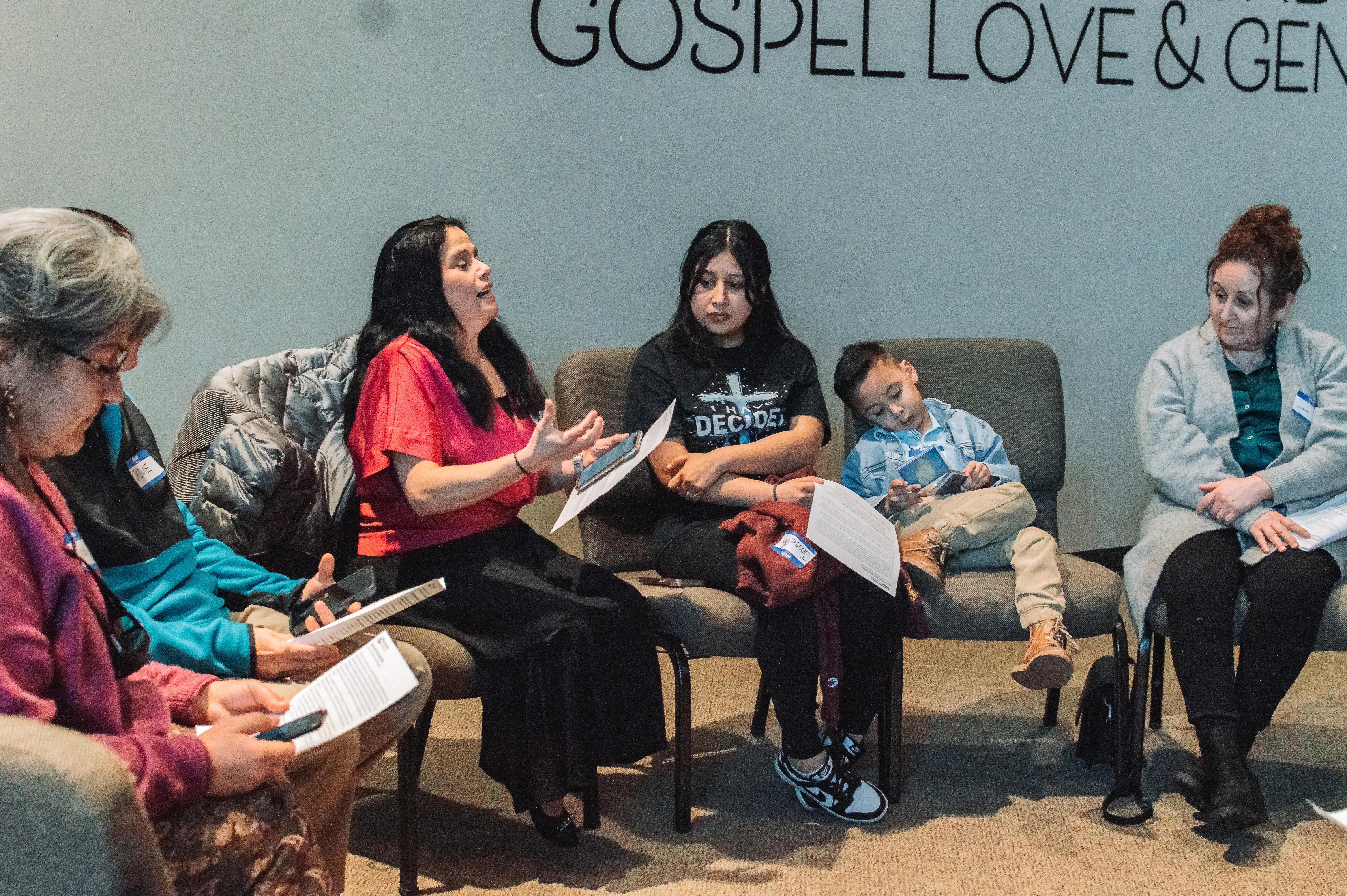 Group in discipleship class praying together