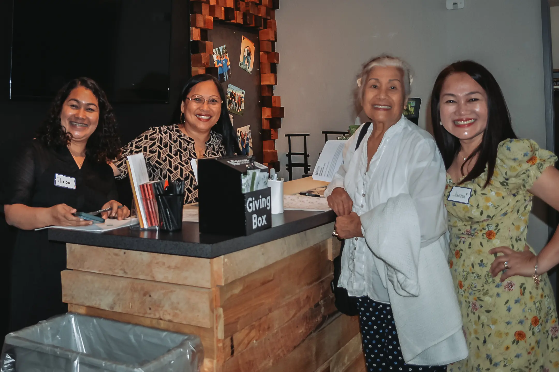 Welcome team greeting new visitors with smiles